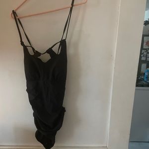 Black halter 1 pc bathing suit with 3 holes around the neckline